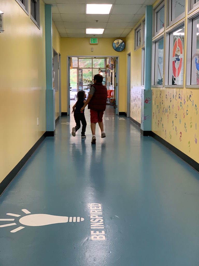 silouette of 2 young children in the hallway of the Canyon Enrichment Center