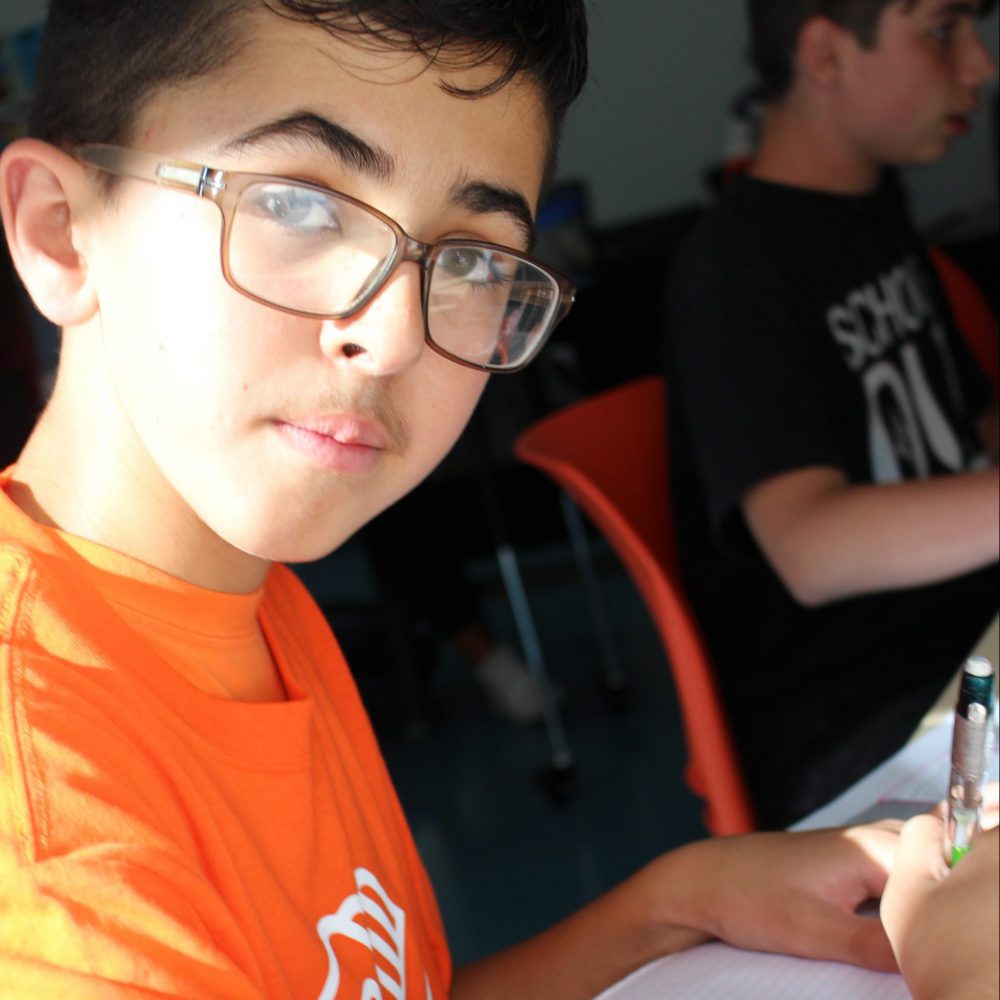 Boy at table doing homework