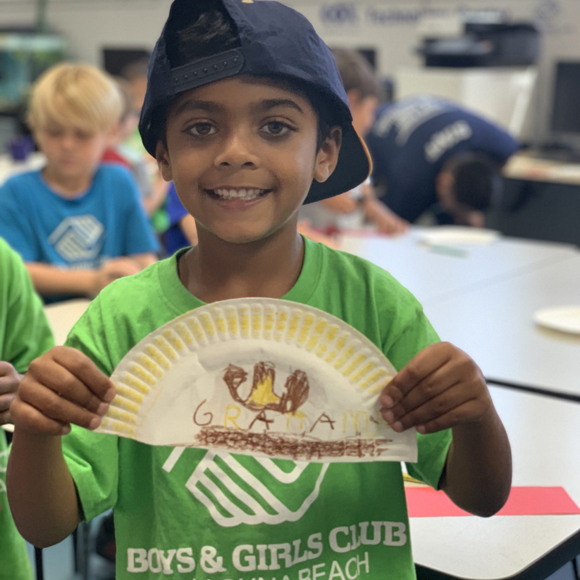 boy with Thanksgiving paper plate turkey