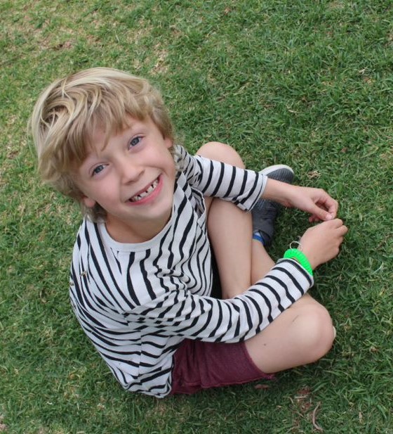 Young Boy on grass at Bluebird Park, Bluebird Enrichnment Center