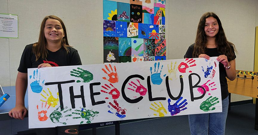 LBBGC at Los Olisos Middle School—2 girls holding THE CLUB sign
