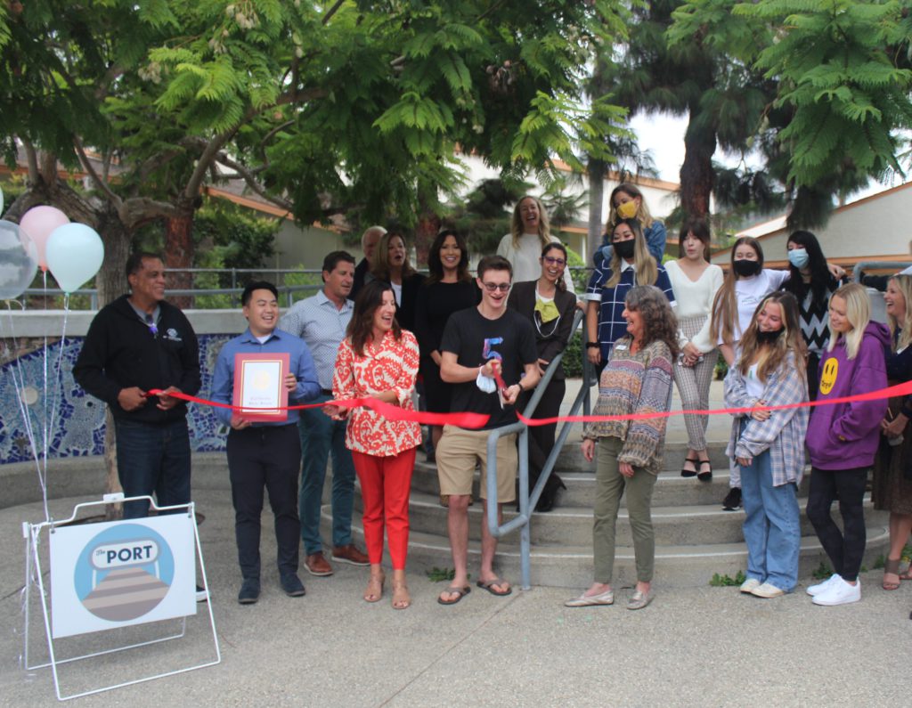 California Government staff, BGCLB staff, and teens stand on the steps of the new teen center, The Port for a ribbon cutting photo