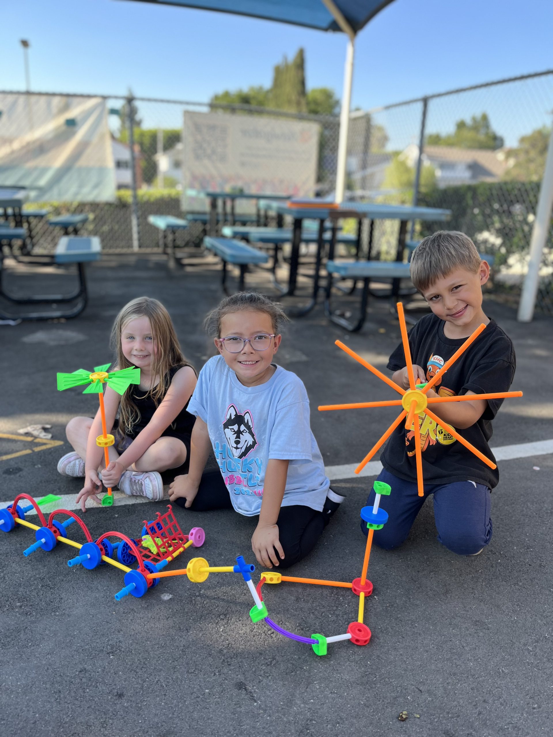 Three Oxford Saddleback Valley students create cool designs with tinker toys