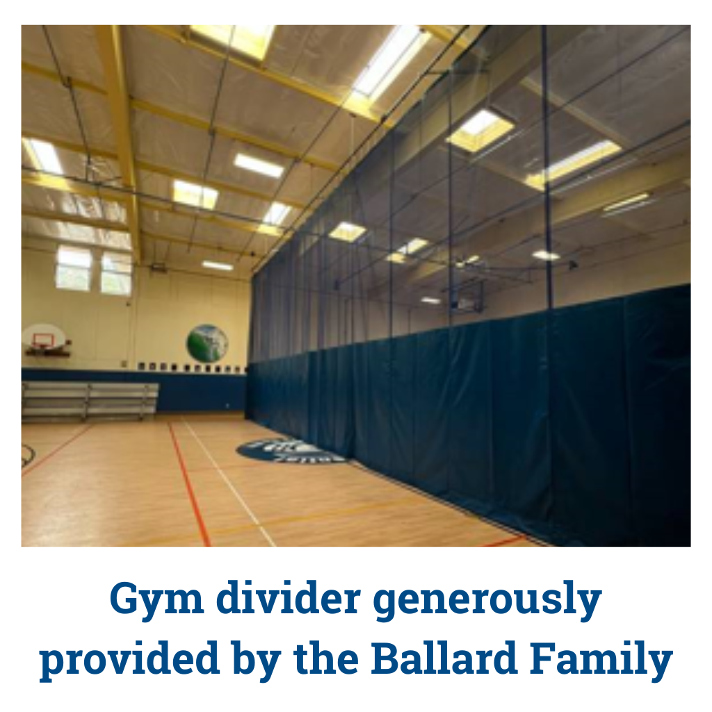 Gym interior with divider curtain and donor recognition text for the Ballard Family